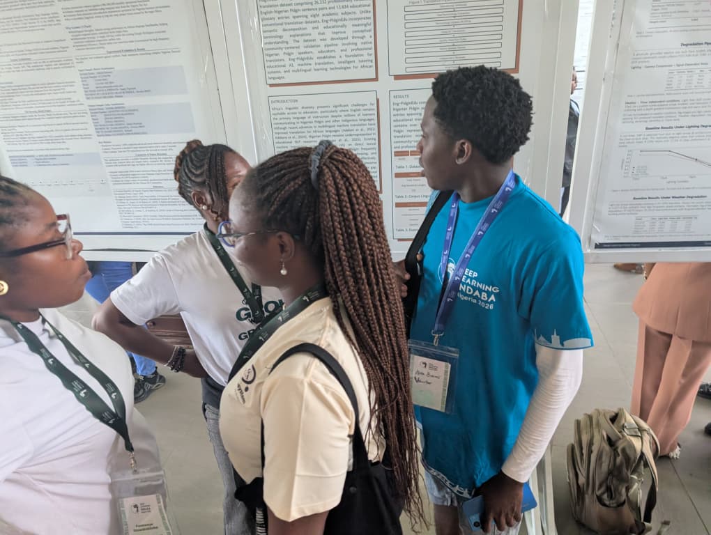 Conference attendees stopping to learn about Eng-PidginEdu at the poster session