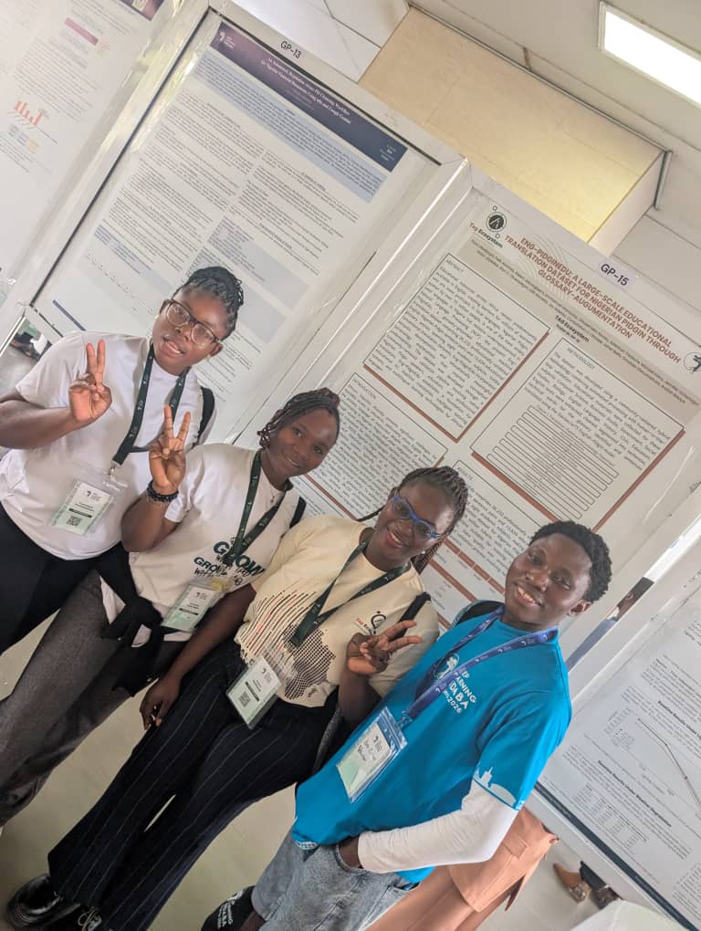 TAG Ecosystem team celebrating in front of the Eng-PidginEdu poster